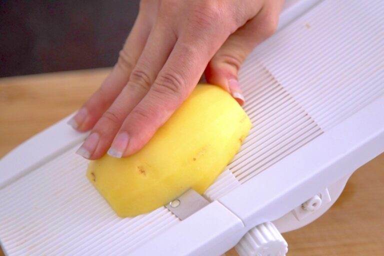 Use a mandoline (or knife) to thinly slice each potato.