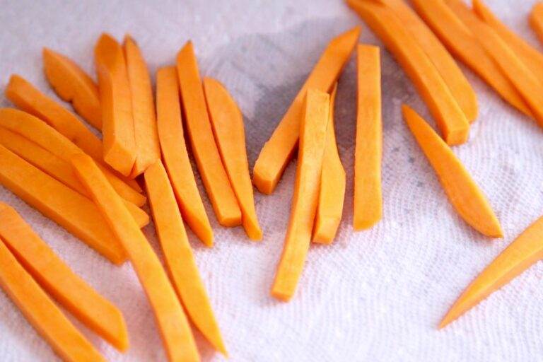 After rinsing (or soaking) be sure to pat your sweet potato fries dry between clean towels. The drier they are, the crispier they'll get!