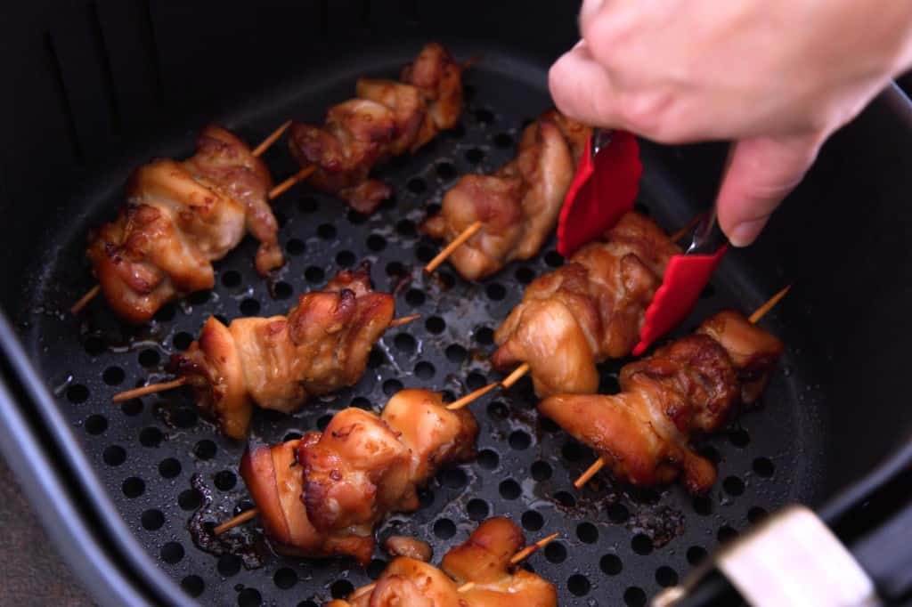 Air fryer teriyaki chicken skewers are done cooking when internal temperature reaches 165F.