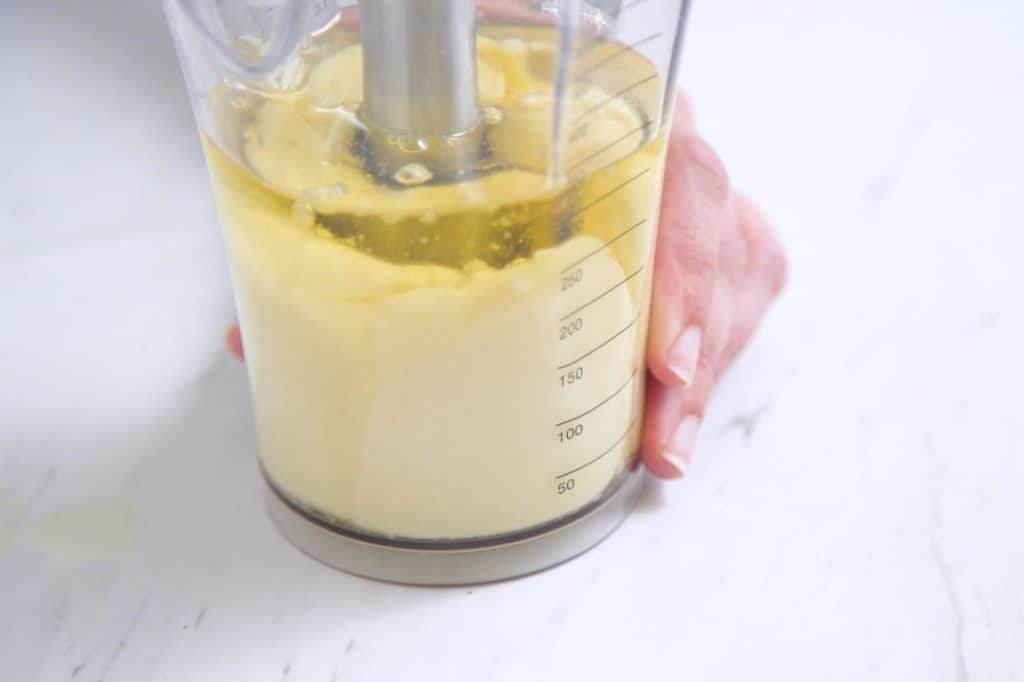 Gently begin to lift hand blender up and down.