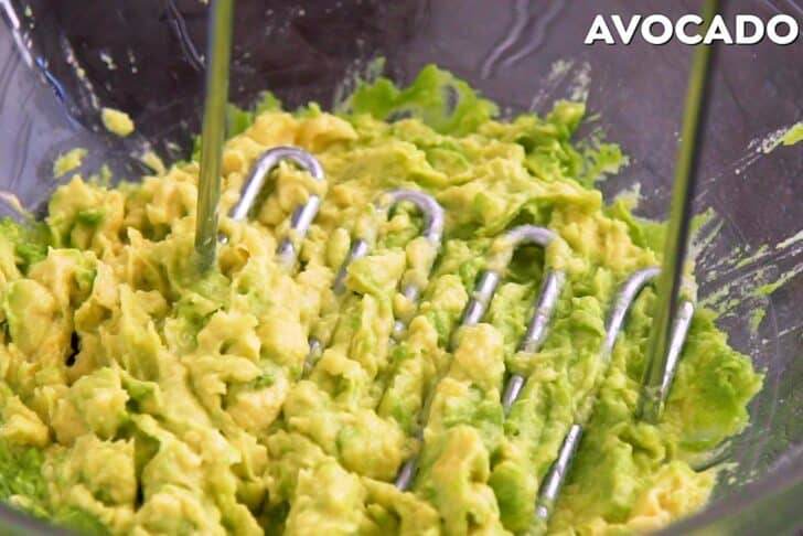 In a large bowl, mash avocado.