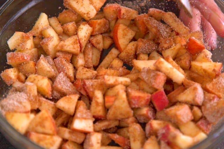 Combine chopped apples with lemon juice, then toss in flour, brown sugar, cinnamon, nutmeg, and salt.