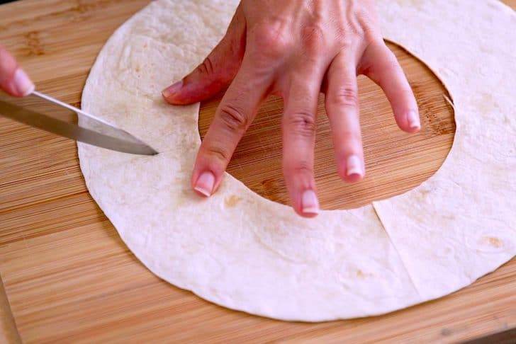 Cut flour tortillas into desired shapes for cinnamon sugar chips.