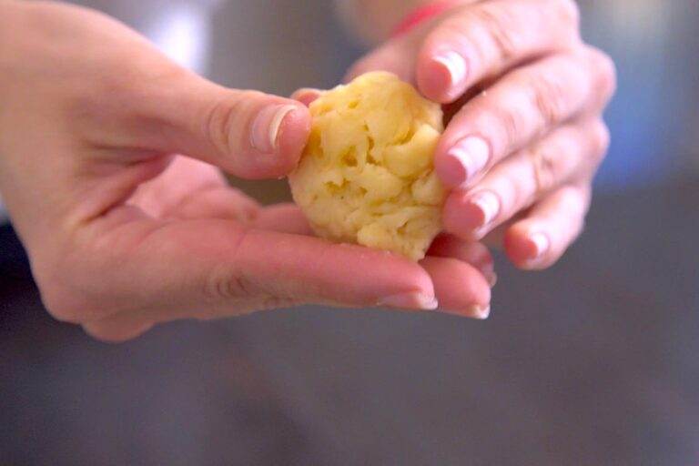 Roll the macaroni into a ball with your hands.