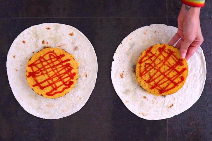 Spread ketchup onto tostada shells, then place on top of meat.