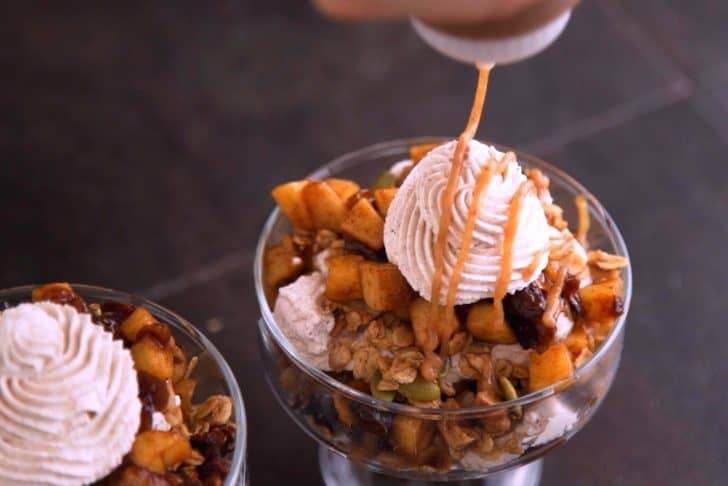 Repeat layers until caramel apple trifles are filled, then finish with whipped cream and date caramel on top.