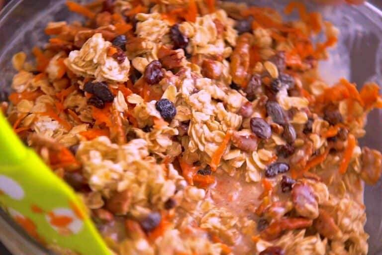 Stir dry oat mixture into the wet mixture, then fold in shredded carrot, nuts, raisins, or whichever mix-ins you like.