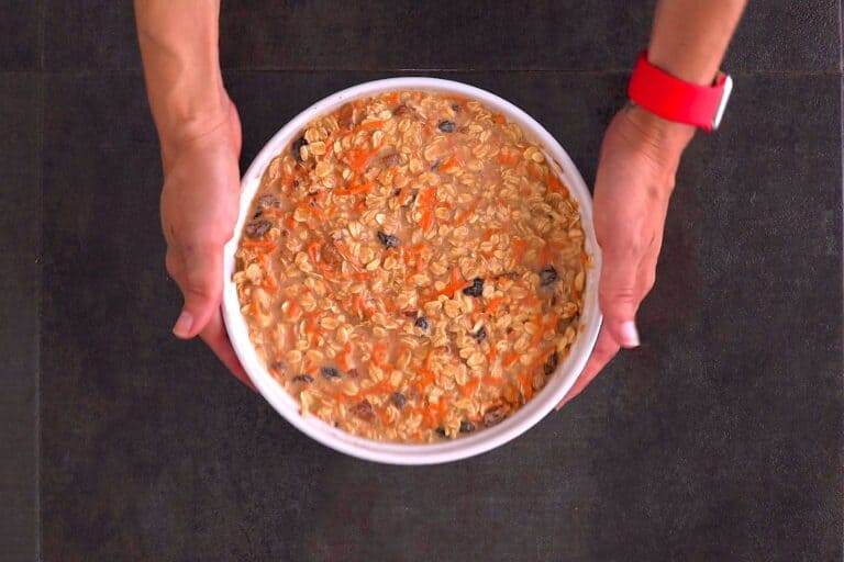 Bake carrot cake oatmeal at 350°F (180°C) for 40-50 minutes, until a knife comes out mostly clean and the casserole is browned and crisp on top.