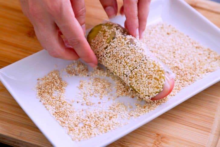 Coat each summer roll in sesame seeds before serving.