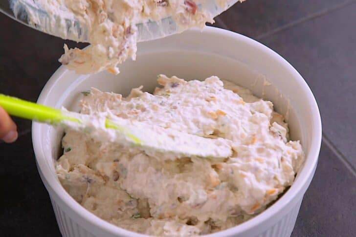 Transfer bacon cream cheese dip to a baking dish.