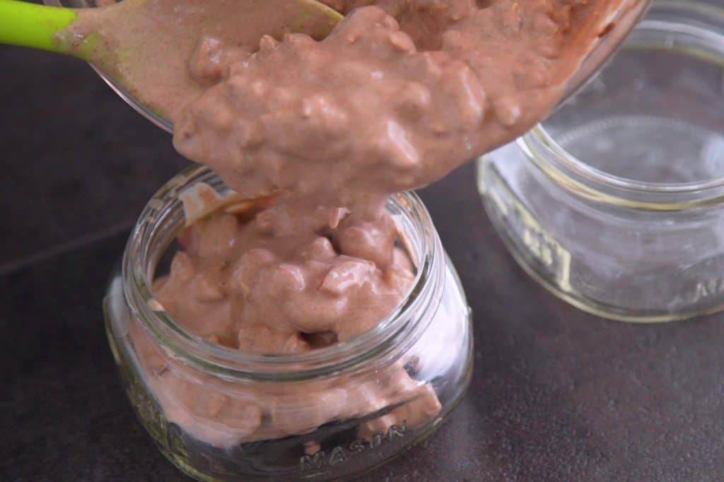 Distribute overnight oats mixture into 2 jars