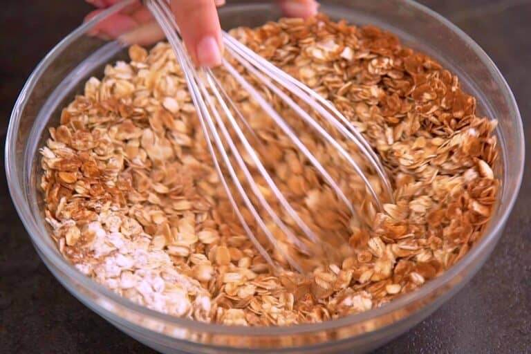 In a bowl, whisk together oats, baking powder, and spices.