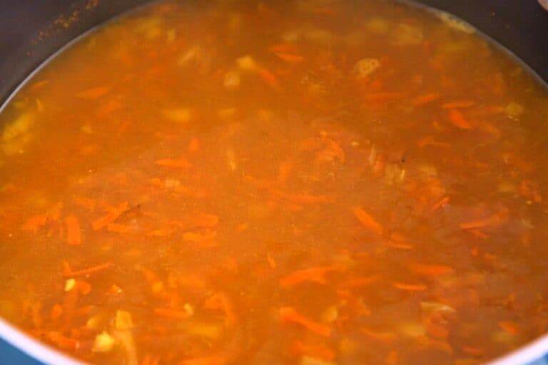 Add chicken broth and bring to a boil, then reduce to a simmer for 15 minutes.