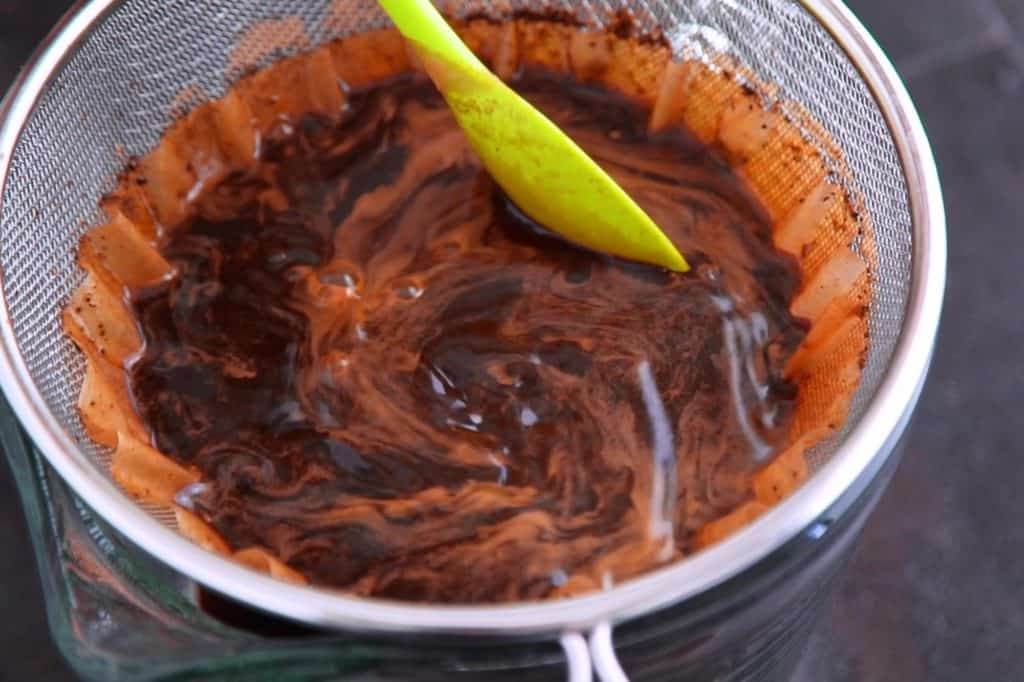Stir to move grounds and help strain