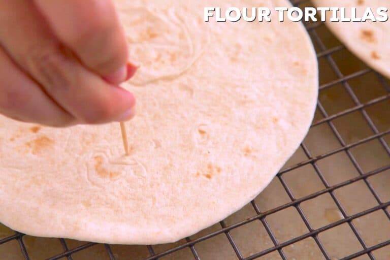 To make Taco Bell Mexican Pizza shells, use a toothpick to poke holes in 2 soft flour tortillas (fajita size, 6-inch diameter).