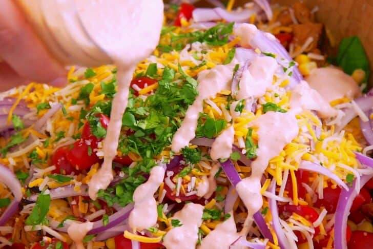 Drizzle dressing onto taco salad.