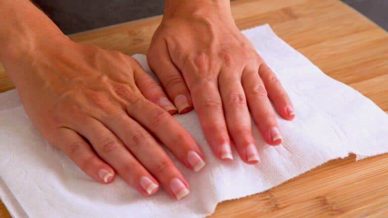 Before cooking, pat salmon filets dry with paper towels to remove excess moisture.