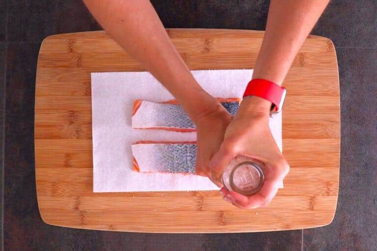 Season skin side of salmon with salt only (no black pepper, or it will burn).