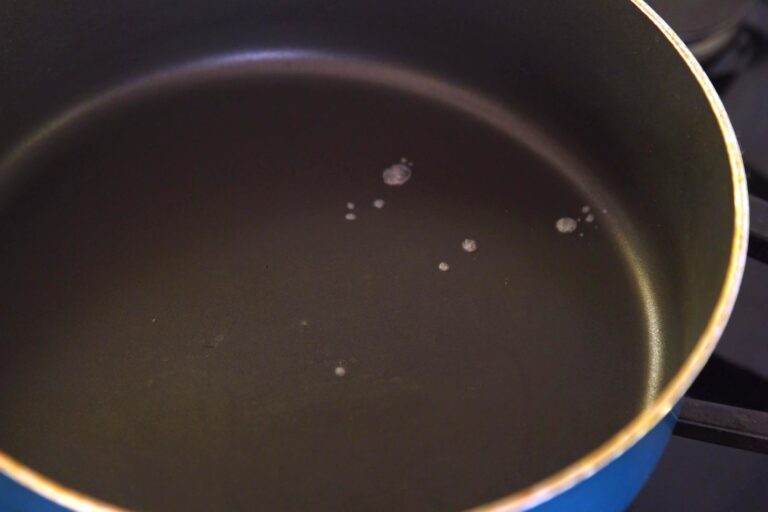 Heat pan over medium-high heat for 3-5 minutes. When droplets of water sizzle and dance when sprinkled onto the pan, it's hot enough.