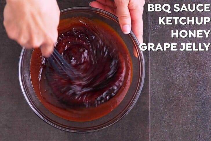 Whisk together barbecue sauce, ketchup, honey, and grape jelly. Set aside.