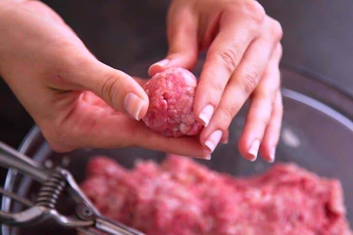 Scoop meat mixture and form into balls with your hands.