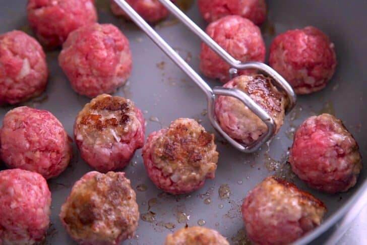 Before adding to slow cooker, sear meatballs in batches on a hot pan.