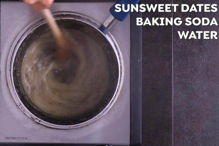 In a saucepan, bring chopped dates, water, and baking soda to a boil over medium heat. Set aside to cool for about 10 minutes.