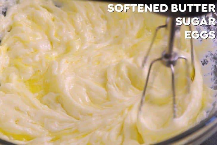 Cream together softened butter and sugar with a hand mixer., until fluffy. Then add eggs 1 at a time, beating to integrate. Finally, beat in Greek yogurt and vanilla, until smooth.