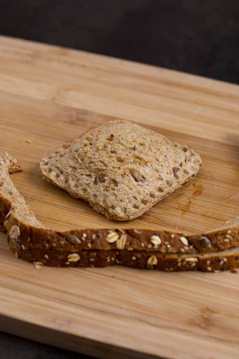 Remove sandwich sealer to reveal completed DIY uncrustables sandwich. Reserve crusts for homemade breadcrumbs, croutons, or snacking.