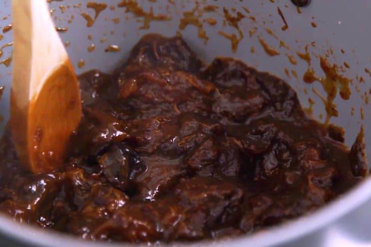 Cook for 20-30 minutes, stirring regularly and mashing with a wooden spoon, until the jam reaches a jelly consistency.