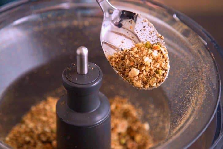 Transfer mixture to a food processor with ground spices, then pulse until finely chopped.