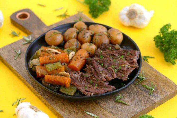 Dutch oven pot roast recipe, how to cook a pot roast in the oven, beef pot roast, pot roast dinner, pot roast with potatoes and carrots, crock pot roast, healthy dinner ideas, pot roast in oven, healthy one pot meals, paleo pot roast