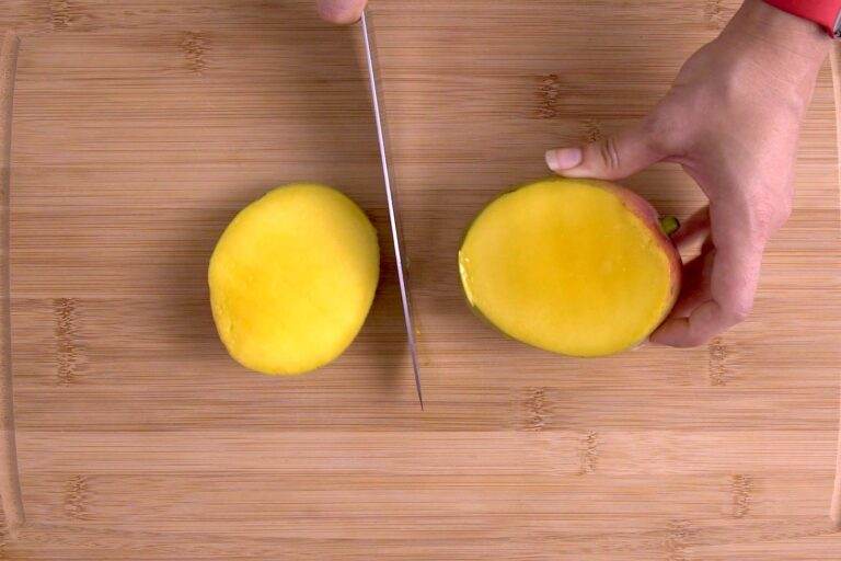 Slice mango lengthwise, avoiding the pit in the middle.