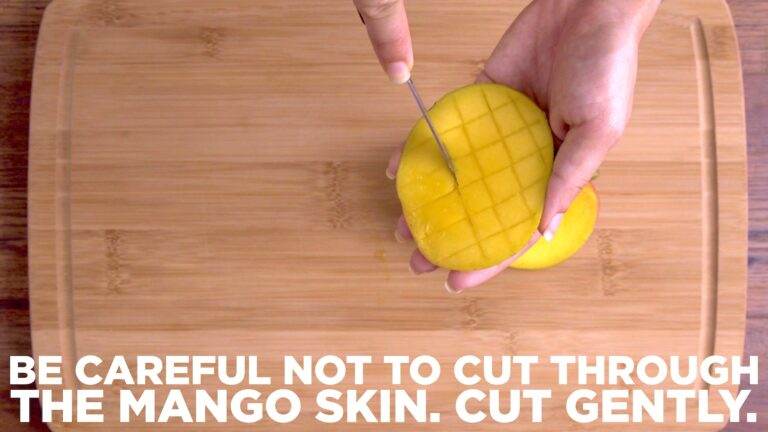 Carefully slice the mango into cubes, without piercing through the mango skin.