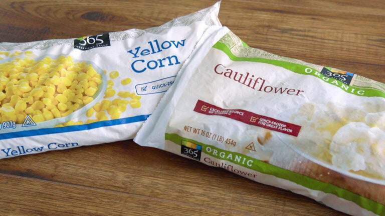 Two bags of frozen vegetables, one bag of corn, and the other cauliflower.