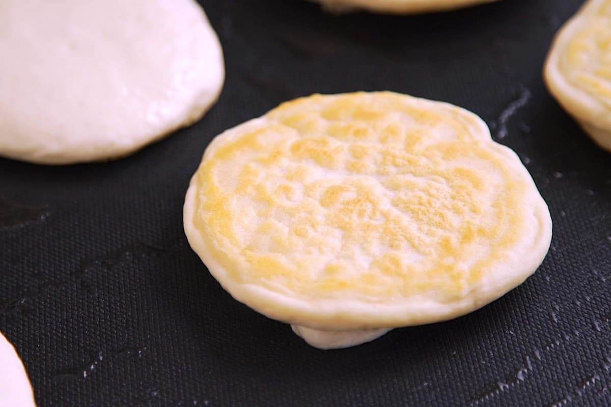 Cook about 3-4 minutes, until bubbles form and bottom surface is lightly browned, then flip. Cook about 1–2 minutes on the other side.