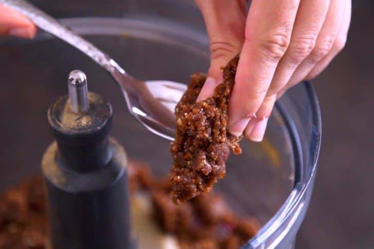 The dough should be sticky and hold together when pressed.