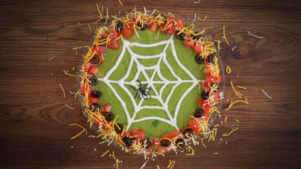 Halloween 7 Layer Dip, Halloween spider 7 layer dip, 7 layer dip Halloween style, 7 layer Mexican dip Halloween, Halloween spider web 7 layer dip, Halloween taco dip, spider web taco dip, Halloween party dips, how to make 7 layer dip