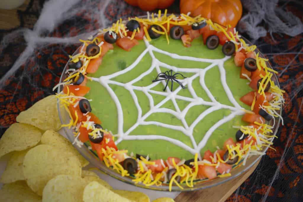 Halloween 7 Layer Dip, Halloween spider 7 layer dip, 7 layer dip Halloween style, 7 layer Mexican dip Halloween, Halloween spider web 7 layer dip, Halloween taco dip, spider web taco dip, Halloween party dips, how to make 7 layer dip