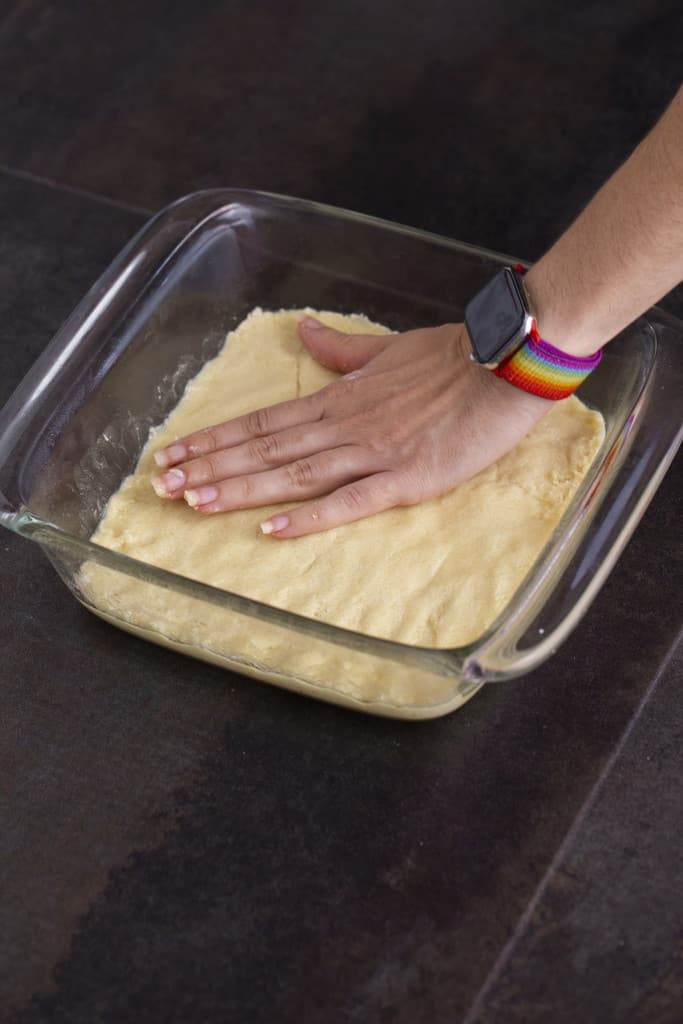Press shortbread crust into bottom of a greased 8x8-inch glass baking dish.