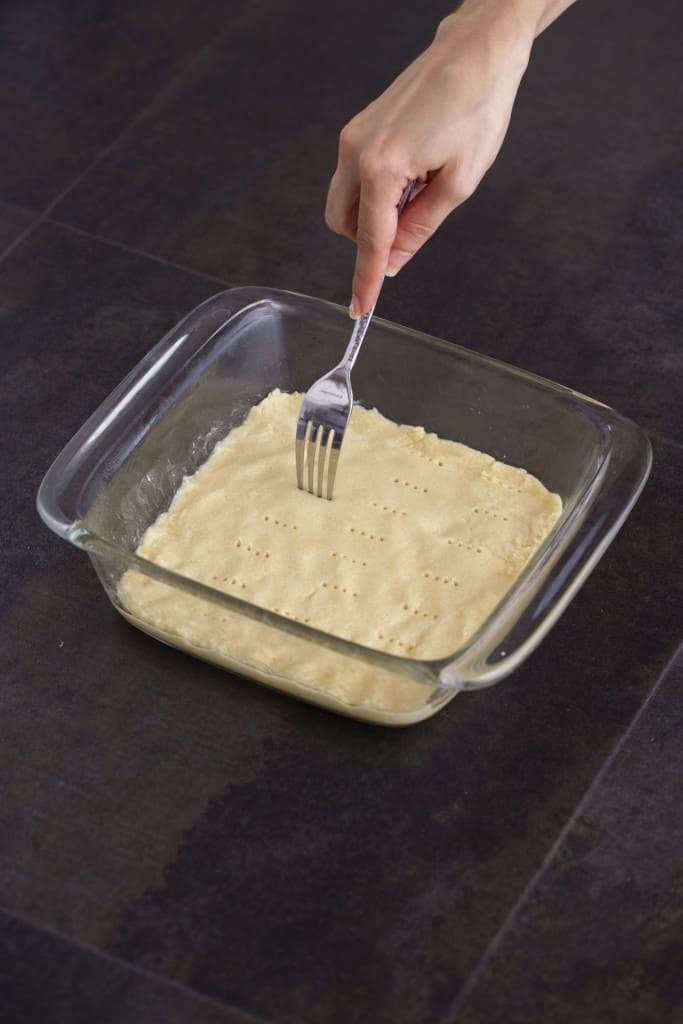 Poke holes in crust with a fork to aerate before baking.