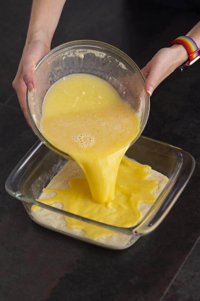 After crust has baked & cooled slightly, pour lemon curd filling on top and bake again at 350°F for 35 minutes.