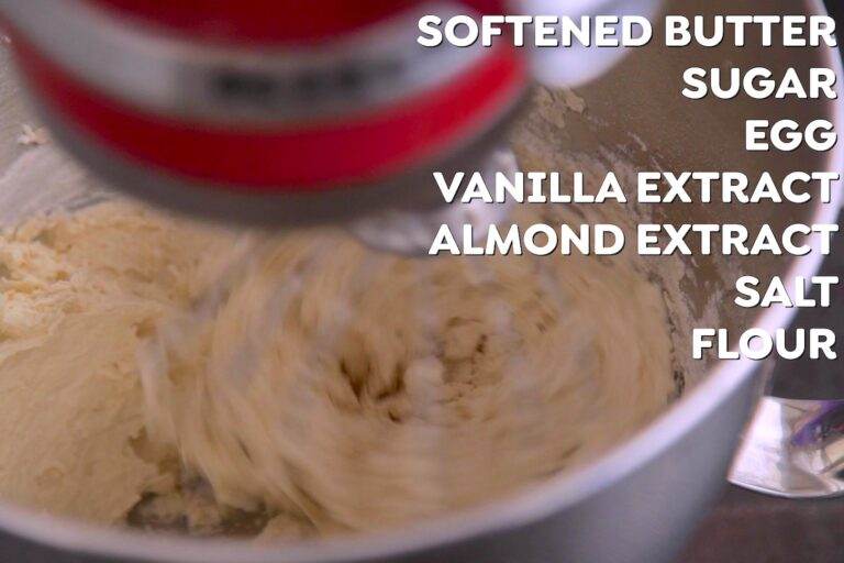 Cream together butter and sugar in a stand mixer for 2-3 minutes, then beat in egg, vanilla, almond extract, and salt, until creamy. Then, slowly add flour until dough forms.