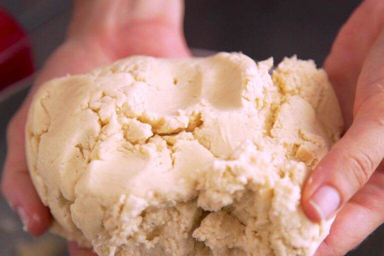 Remove formed dough from stand mixer and collect with hands.