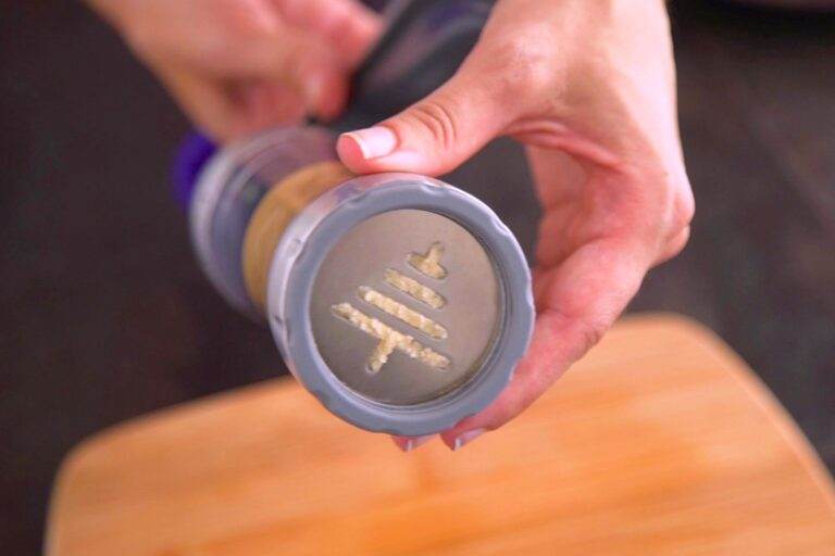 Transfer spritz cookie dough into a cookie press.