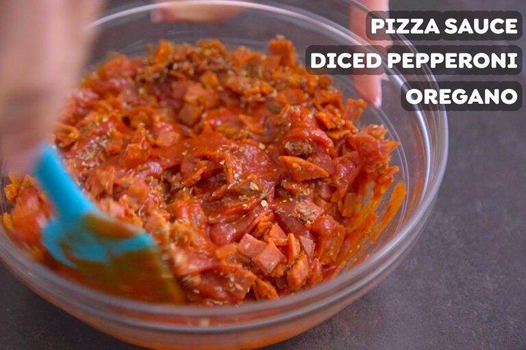 Mix together pizza sauce, chopped pepperoni, & oregano to make the filling for your pizza rolls.