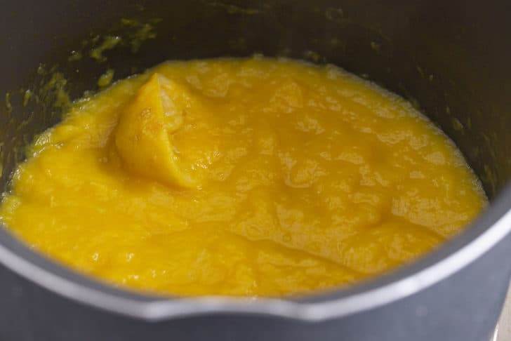Reduce heat, uncover, and cook 60-90 minutes—mashing the fruit and stirring regularly until thickened.