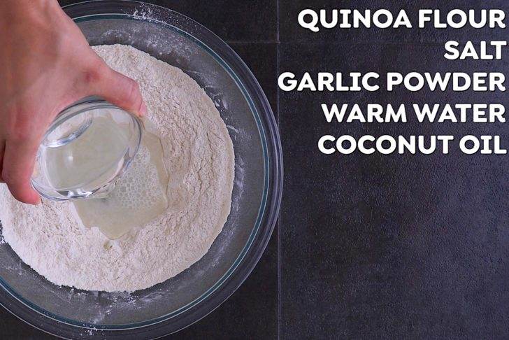 Combine quinoa flour and seasonings in a bowl. Create a well in the center, then add water and melted coconut oil. Mix with a wooden spoon to form a dough.