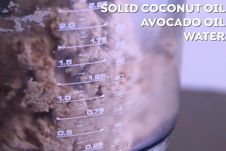Next, pour in liquid coconut oil and cold water, pulsing until a sticky ball forms.
