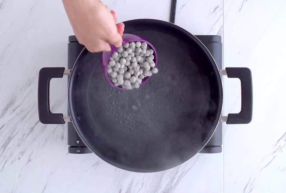 Add tapioca pearls to boiling water, stir lightly, then cover and cook for 3 minutes.